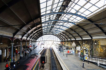 Passengers waiting on the railway platform in the Newcastle central railway station, Newcastle upon...