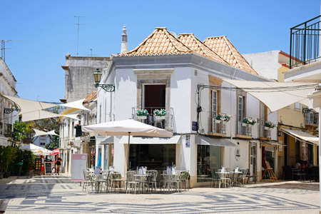 Restaurants and shops on the corner of R da Gama in the city centre, Faro, Algarve, Portugal,...