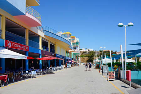 View along the cafe lined promenade in the marina, Albufeira, Algarve, Portugal, Europe.のeditorial素材