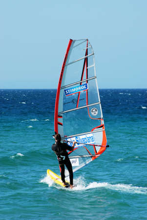 TARIFA, SPAIN - SEPTEMBER 14, 2008 - Man windsurfing off Valdevaqueros beach, Tarifa, Cadiz Province, Andalusia, Spain, Europe, September 14, 2008.のeditorial素材