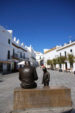 CONIL DE LA FRONTERA, SPAIN - SEPTEMBER 14, 2008 - Statue of a man and boy in the Plaza de Espana, Conil de la Frontera, Cadiz Province, Andalusia, Spain, Europe, September 14, 2008.のeditorial素材