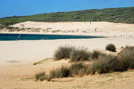 TARIFA, SPAIN - SEPTEMBER 14, 2008 - Kite surfer off Valdevaqueros beach with tourists enjoying the setting, Tarifa, Cadiz Province, Andalusia, Spain, Europe, September 14, 2008.のeditorial素材