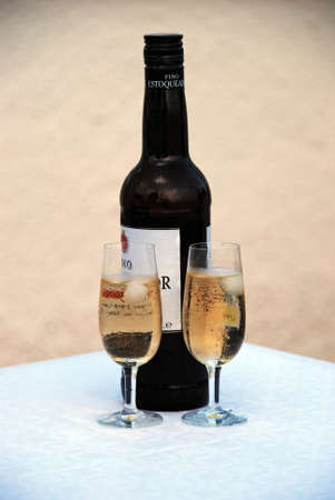 Two glasses of fino sherry with the bottle to the rear, Andalusia, Spain.のeditorial素材