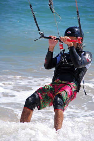 TRAFALGAR, SPAIN - SEPTEMBER 14, 2008 - Kitesurfer riding the waves, Cabo Trafalgar, Cadiz Province, Andalusia, Spain, Europe, September 14, 2008.のeditorial素材