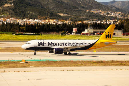 MALAGA, SPAIN - March 18, 2013 - Monarch Airlines Airbus A320 taxiing at the airport, Malaga, Spain, March 18, 2013.のeditorial素材