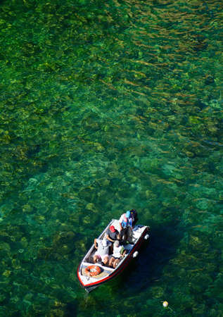 Elevated view of tourists in a small tour boat in the bay, Ponta da Piedade, Lagos, Algarve, Portugal, Europe.のeditorial素材