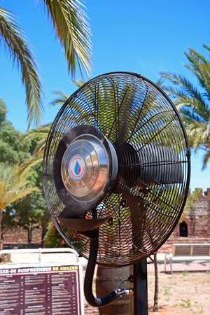 Electric cooling fan in the castle courtyard, Silves, Portugal, Europe.のeditorial素材