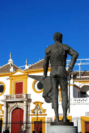 SEVILLE, SPAIN - NOVEMBER 15, 2008 - View of the bullring with a matador statue in the foreground, Seville, Seville Province, Andalusia, Spain, Europe, November 15, 2008.のeditorial素材