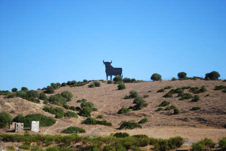 TARIFA, SPAIN - SEPTEMBER 14, 2008 - Osborne bull statue on a hillside, near Tarifa, Costa de la Luz, Cadiz Province, Andalusia, Spain, Europe, September 14, 2008.のeditorial素材