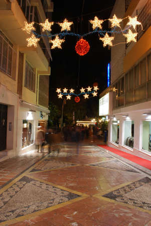 Festive Christmas decorations along a town centre shopping street at night, Marbella, Costa del Sol, Malaga Province, Andalucia, Spain, Europe.のeditorial素材