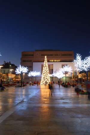 View of the Town Hall (Ayuntamiento) at night with a Christmas tree and lights in the foreground, Fuengirola, Costa del Sol, Malaga Province, Andalucia, Spain.のeditorial素材