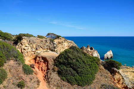 Elevated view of the cliffs with views across the ocean, Praia da Rocha, Portimao, Algarve,...