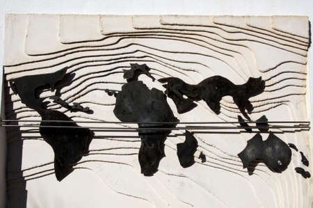 Metal world map on wave pattern on the wall to La Concepcion Historical Botanical Gardens, Malaga, Costa del Sol, Malaga Province, Andalucia, Spain, Europe.のeditorial素材