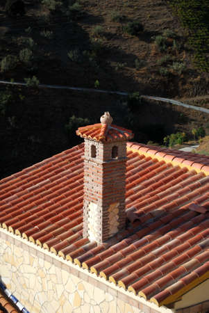 Traditional Spanish brick chimney with an ornamental jug on top, El Valdes, Malaga Province, Andalucia, Spain, Europe.の写真素材