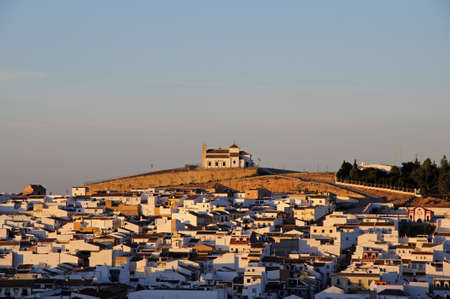 ANTEQUERA, SPAIN - NOVEMBER 11, 2009 - View over the town towards the church on the hill (Ermita del Cerro) in the late afternoon sun, Antequera, Malaga Province, Andalucia, Spain, Europe, November 11, 2009.のeditorial素材