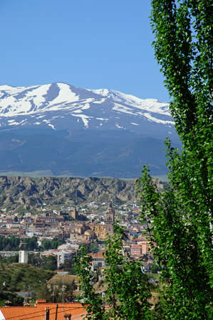 GUADIX, SPAIN - MAY 5, 2010 - View of the town and Cathedral with the snow capped mountains of the Sierra Nevada to the rear, Guadix, Granada Province, Andalucia, Spain, Europe, May 5, 2010.のeditorial素材