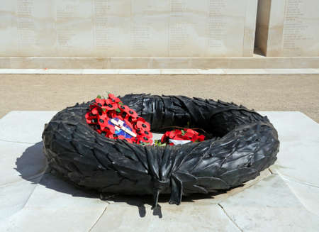 ALREWAS, UK - MAY 21, 2014 - Poppy wreath in the inner circle of the Armed Forces Memorial, National Memorial Arboretum, Alrewas, Staffordshire, UK, May 21, 2014.のeditorial素材