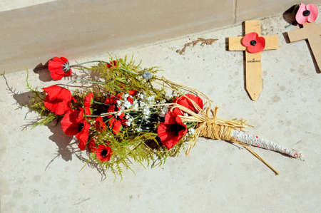 ALREWAS, UK - MAY 21, 2014 - Poppy bouquet in the inner circle of the Armed Forces Memorial, National Memorial Arboretum, Alrewas, Staffordshire, UK, May 21, 2014.のeditorial素材