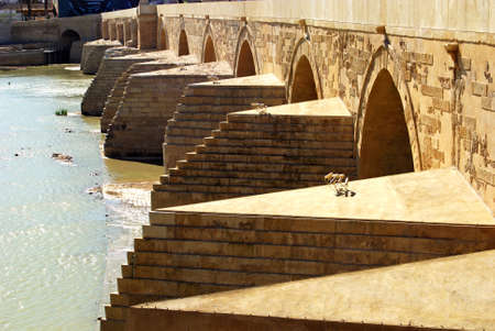 View of the first century Roman bridge (post 2007 restoration) across river Guadalquivir, Cordoba, Spain.のeditorial素材