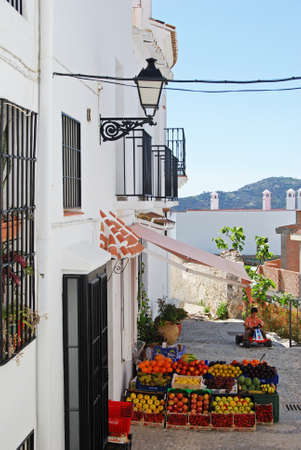 Typical village street with fruit and veg for sale outside shop, Frigiliana, Spain - March 19, 2008のeditorial素材