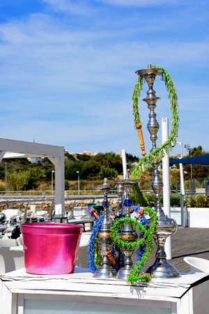 Hookah pipes at a waterfront restaurant in the marina, Albufeira, Algarve, Portugal, Europe.
