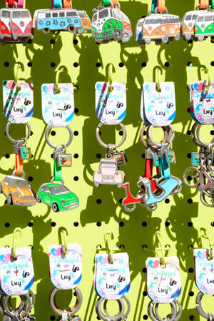 Display rack of car key rings outside a village shop, Alvor, Algarve, Portugal, Europe.のeditorial素材