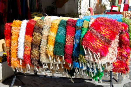 Locally made rugs for sale in a village crafts and souvenir shop, Pampaneira, Spain.のeditorial素材