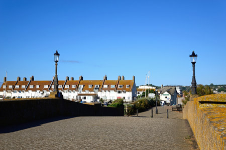 AXMOUTH, UK - AUGUST 30, 2022 - Footbridge across the River Axe looking towards Seaton, Axmouth, Devon, UK, Europe, August 30, 2022.のeditorial素材