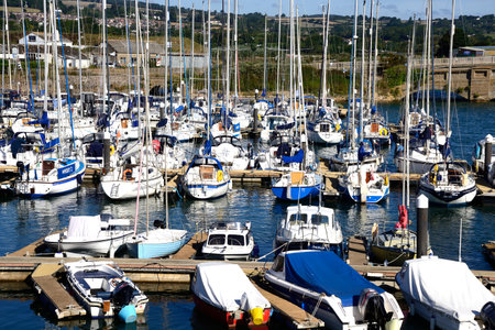 AXMOUTH, UK - AUGUST 30, 2022 - Yachts and boats moored along the River Axe with views across the Devon countryside, Axmouth, Devon, UK, Europe, August 30, 2022.のeditorial素材