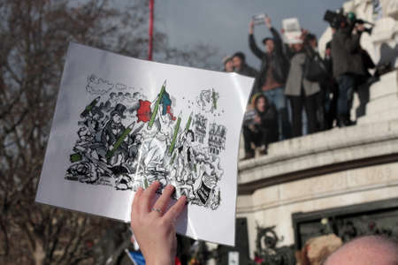 Caricature drawing DURING event on Republic Square in Paris Against Terrorism and in memory of the attack Against satirical newspaper Charlie Hebdo-January 11, 2015. Franceのeditorial素材