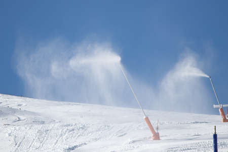 Snow gun on ski trail Grandvalira in Andorraの写真素材
