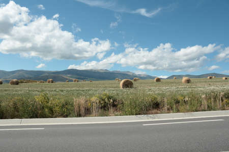 Road and haystack in french Cerdanya, Pyreneesの写真素材