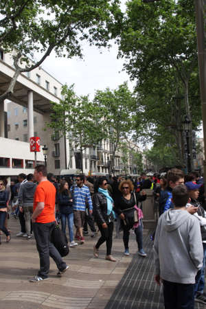 People walking on the boulevard La Rambla in Barcelo
