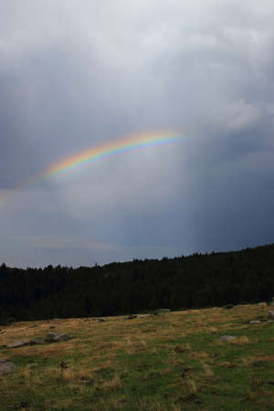 Rainbow in the French Pyrenees. Occitanie in south of Franceの写真素材