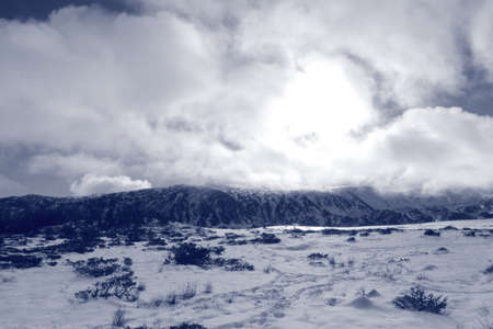 snowy landscape and cloudy sky in Pyreness. Occitanie in south of Franceの写真素材