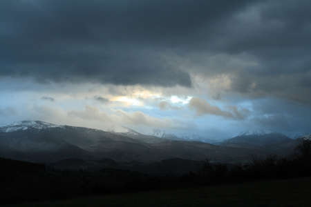 Dramatic landscape wtith cloudy sky in the French Pyrenees. Occitanie in south of Franceの写真素材