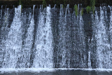 artificial waterfall in Aude river in Occitanie, South of Franceの写真素材