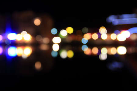 Round multicolored light on black background