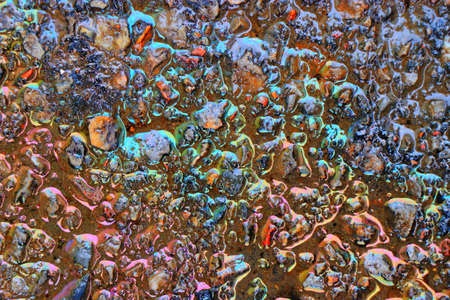 background of drop of motor oil colorfulの写真素材