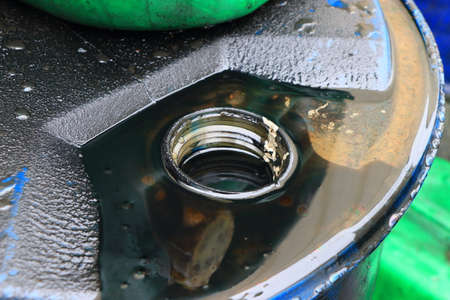 engine oil and oil cans in a car garageの写真素材