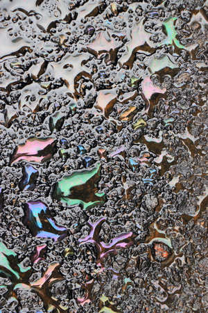background of drop of motor oil colorfulの写真素材