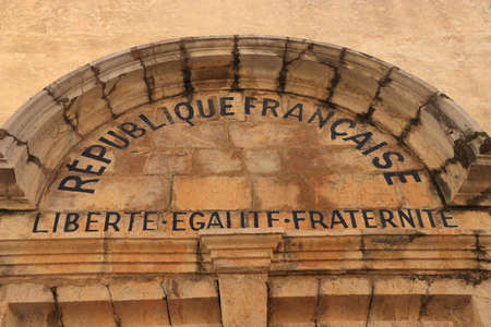 written on a facade: French republic, freedom, equality and fraternityの写真素材