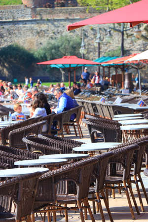 Tourists sitting on the terrace of a french cafe in Collioure, eastern pyrenean in the southern of Franceの写真素材
