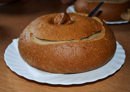 Traditional mushroom soup served in a bread bowlの写真素材