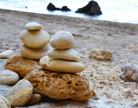 Zen stones stacked at beachの写真素材