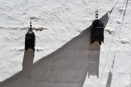 Pair of street lamps on a wall