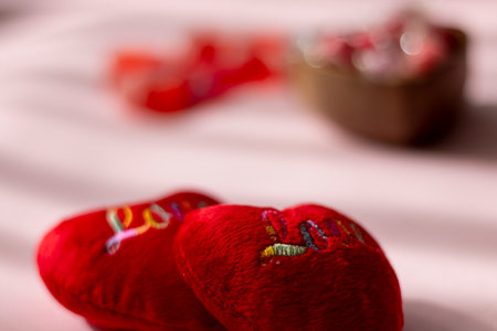 Red heart on a pink background. Valentine's Day. Selective focus.の写真素材