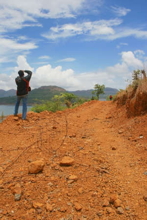 crossing the barbed wire on the way to mulshi dam