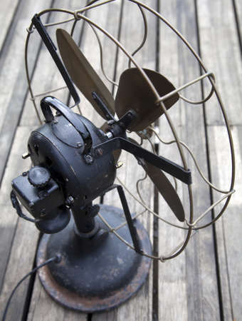 old fan on a aged wodden deckingの写真素材
