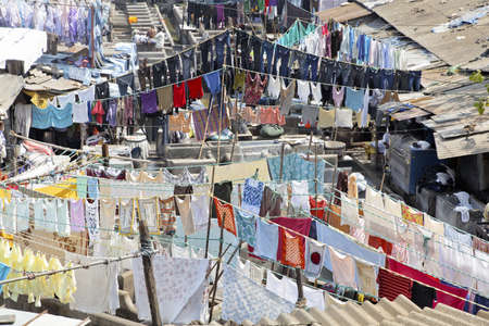 Mumbai, Dhobhi ghat, community at work and clothes drying on washing lines at commercial laundryのeditorial素材